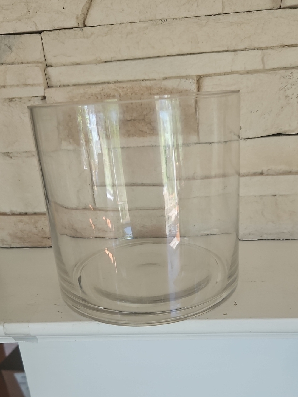 Round Clear Glass Cylinder Vase . Approximately 6" wide x 6" high.